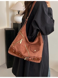 Brown suede dumpling backpack with retro motorcycle zippers and metallic rivets