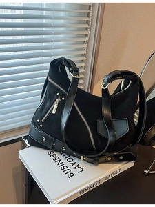 Retro black leather dumplings style tote bag with punk rivets and silver hardware details