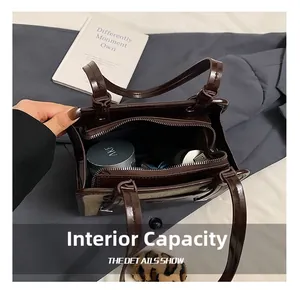 Deep coffee patent leather tote bag interior showing large capacity and zipper pocket