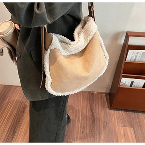 Detail of winter sherpa tote bag with faux suede texture and adjustable leather strap
