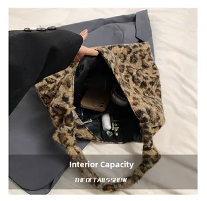 Macro detail of spacious interior with zipper pocket in leopard print plush tote bag