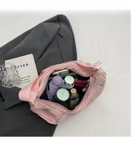 Spacious interior of pink fabric tote bag showing umbrella, thermos, and daily essentials