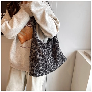 Detail of plush leopard print tote bag showing soft faux fur texture and autumn style