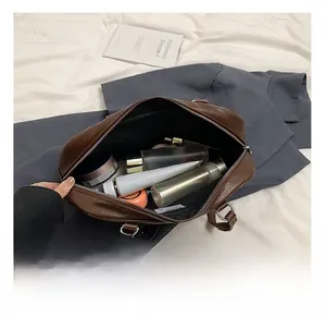 Deep brown PU tote bag showing spacious interior filled with various cosmetics