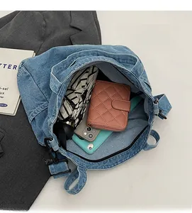 Interior view of denim tote bag showing large capacity for phone, wallet and umbrella