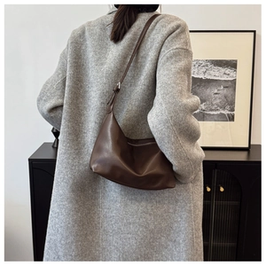 Deep brown faux leather hobo bag styled with a grey wool coat for a chic commute look