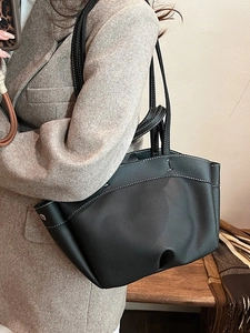 Chic black pebbled leather tote bag with contrast stitching and large capacity