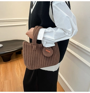 Brown handmade knitted bucket bag with waffle texture and mini coin purse detail
