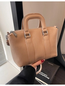 Retro khaki Boston bag with vertical quilting and silver hardware for women