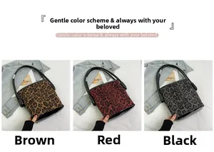 Three leopard print bucket bags in brown, red and black with sleek leather handles