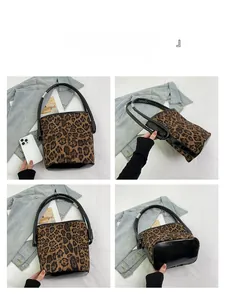 Detail views of leopard print bucket bag with glossy base and silver metal hardware