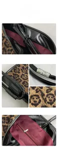 Macro view of leopard print tote bag features burgundy lining and secure zipper pocket