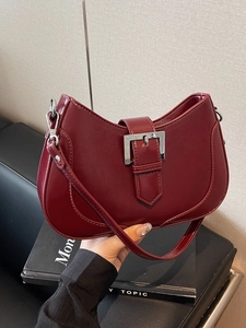 Burgundy crescent armpit bag with large silver square buckle and slim strap
