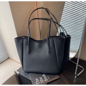 Detail view of premium black lychee texture tote bag with Fashion Trend logo imprint