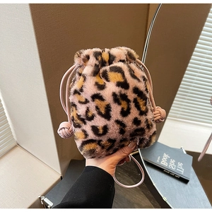 Detail of pink leopard faux fur bucket bag with stylish leather drawstring closure