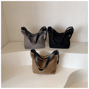 Chic autumn faux shearling shoulder bags in grey, black, and brown with leather straps