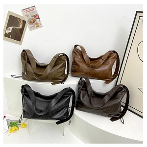Detail showing the large capacity shoulder bags in black, chocolate, brown, and dark green