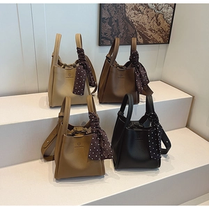 Litchi pattern leather bucket bags in four colors with decorative polka dot scarves
