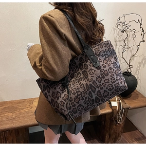 Leopard print tote bag styled with brown blazer for a chic autumn work outfit