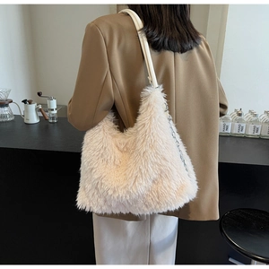 Detailed side view of plush apricot hobo bag featuring faux fur and silver chain strap