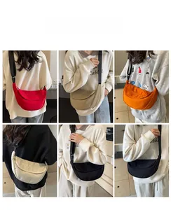 Multiple colors of canvas dumpling bags shown in various styles by models in a collage