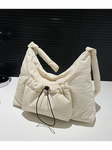 Quilted off-white nylon shoulder bag with drawstring pocket and knotted strap detail