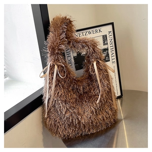 Detail of soft brown faux fur tote bag with decorative beige satin ribbon bows