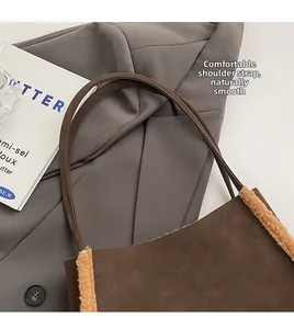 Close-up of comfortable slim leather straps and suede texture on brown tote bag
