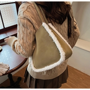 Chic olive green faux fur trim shoulder bag styled with beige knit sweater