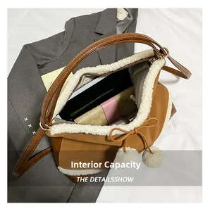 Large capacity interior of brown leather vintage bucket bag with fuzzy trim and soft lining