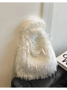 Chic white fuzzy tote bag with long fringe tassels and decorative silk ribbon bows