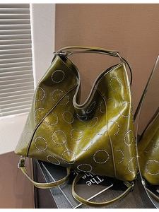 Olive green large hobo shoulder bag with glossy finish and circular metal rivet decorations