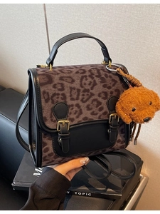 Large leopard print patchwork handbag with black leather flap and cute plush dog charm