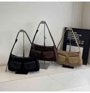 Three matte suede underarm bags in black brown and khaki with flap pockets and thin straps