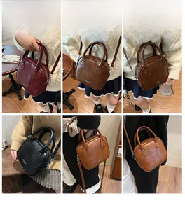 Multi-colored textured PU leather crossbody bags with embossed pattern and metal strap detail