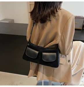 Retro black frosted leather underarm bag with double front pockets and adjustable strap