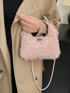 Elegant pink plush crossbody bag with leather strap and silver turn-lock closure