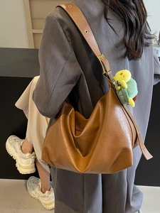 Brown faux leather large hobo shoulder bag with a cute green turtle keychain pendant