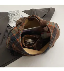 Detail showing spacious interior of plaid wool tote bag with matching inner pouch