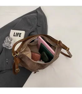 Top-down view of spacious tote bag interior holding tablet, phone, and wallet