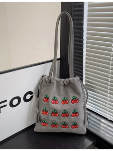 Minimalist grey drawstring tote bag with red cherry embroidery and stylish tassels
