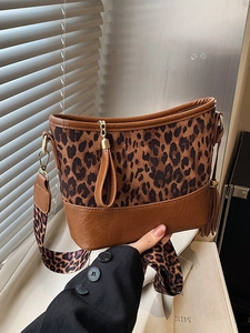 Stylish leopard print bucket bag with wide shoulder strap and leather splicing detail