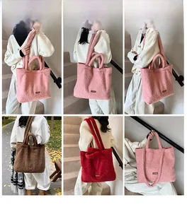 Detail view of large plush tote bags in pink, brown, and red with soft fuzzy texture
