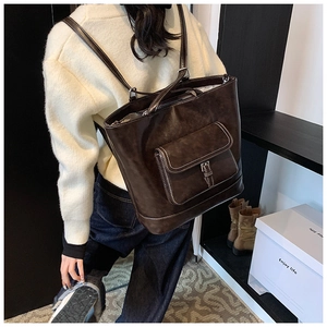 Detailed back view of a dark brown multi-functional tote bag with large capacity