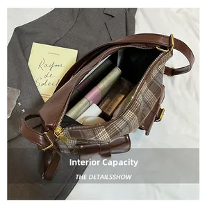 Internal capacity of the retro plaid crossbody bag showing storage for daily essentials
