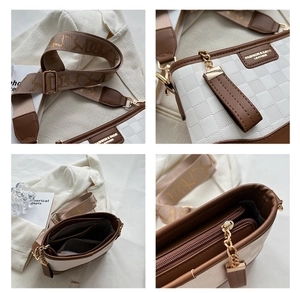 Detail view of checkerboard pattern leather crossbody bag with wide jacquard strap