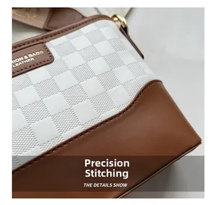 Detailed view of exquisite stitching and textured white checkered pattern on a bucket bag