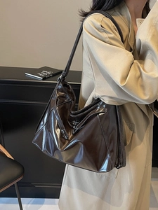 Retro dark brown glossy leather tote bag with contrast stitching and adjustable strap