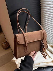 Vintage caramel matte suede shoulder bag with long handles and decorative pendant