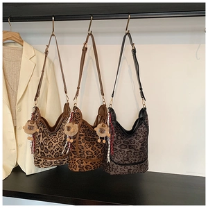 Three leopard print tote bags in brown and grey with cute plush sheep charms